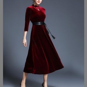 Maroon/red velvet dress.